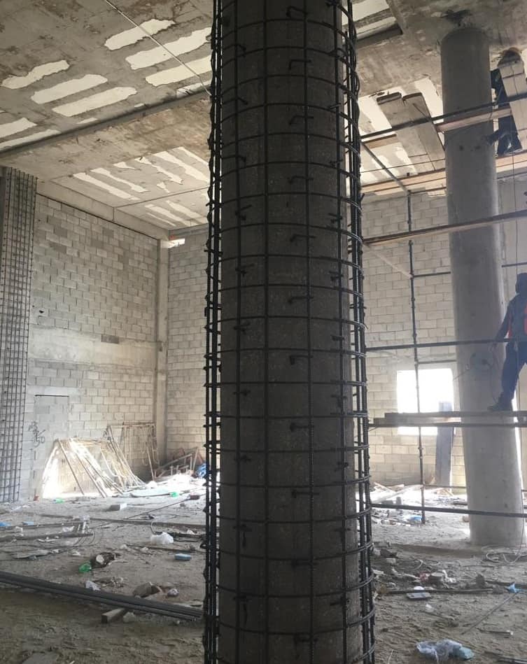 Strengthening A hotel using concrete Jacketing for columns.